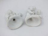 pair of white porcelain figurines of cherenshes and cherenshes