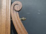 a close up of a door handle on a wooden door