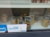 a display case with cereal, cereal, and other food items in it
