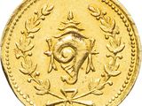 an image of a gold coin with an eye and laurels on it