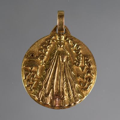 l'image d'une pièce d'or sur laquelle figure une femme