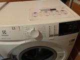 a washing machine that is sitting in a room