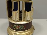 a small clock that is sitting on a table