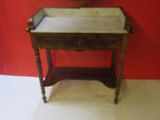 a small wooden table with a marble top in a room