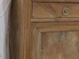 a wooden cabinet with a drawer on top of it