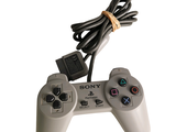 a video game controller that is connected to a charger