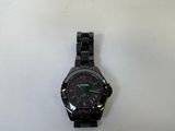 a watch that is laying on a white surface