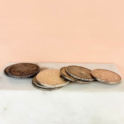 a pile of coins sitting on top of a table