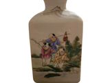 a vase with a picture of a man and a dog on it