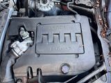 the engine of a car with its hood open and the hood down