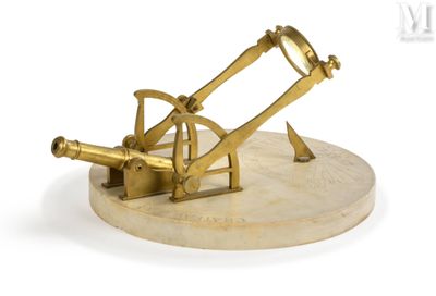 an antique brass telescope on a marble base on a white background