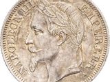 a close up of a coin with a man ' s face on it