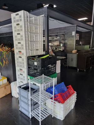 many crates stacked on top of each other in a warehouse