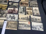 a lot of old postcards that are on a table