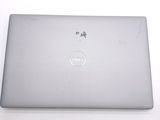 dell laptop computer sitting on top of a white table