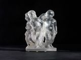 sculpture of three people on a black background