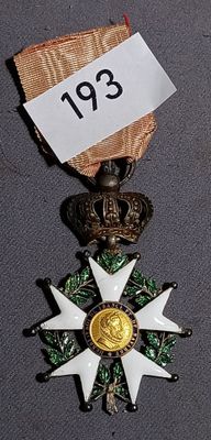 a medal with a star on it and a ribbon around it