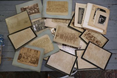 a lot of old photos on the table