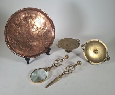several different types of brass objects including a bowl, spoon, and a magnifying glass