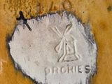 a close up of a plate with a picture of a windmill on it