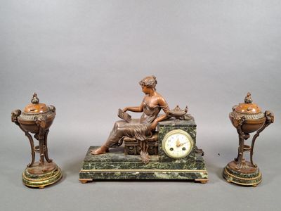 a statue of a woman sitting on a table next to a clock