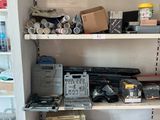 a shelf full of tools and other items in a room