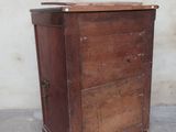 a small wooden cabinet with a drawer on top of it