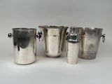 four silver ice buckets with handles and handles on a white background