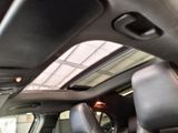 a view of a car ' s sunroof from the inside
