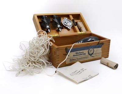 a wooden box with a bunch of tools inside of it
