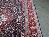 rug on the floor in a room with carpeting on the floor
