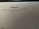 a picture of a macbook pro sitting on a table