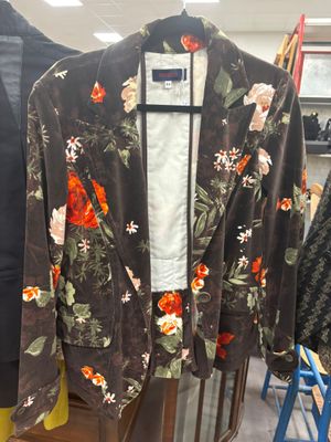 a jacket hanging on a rack in a clothing store