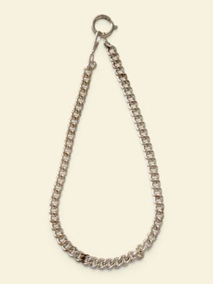 a close up of a necklace with a chain on a white background