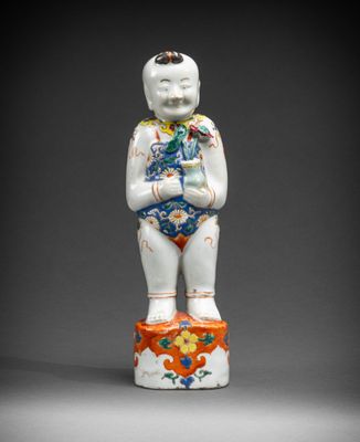 an image of a figurine of a boy with a flowered body