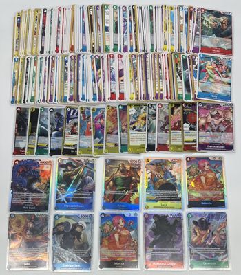 a large collection of pokemon cards are on a table