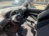 the interior of a car with a steering wheel and a dashboard