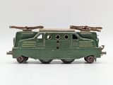 a green toy train on a white surface with a white background