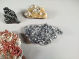three different types of crystals on a white surface