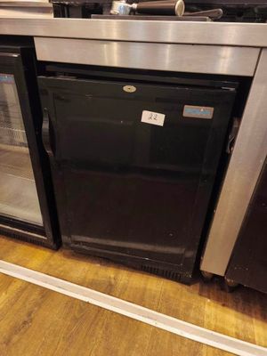 a black and silver refrigerator and a black and silver oven