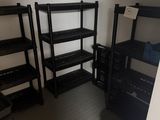 a room with shelves and a bucket on the floor