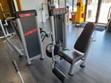 a gym room with a bench, weights, and other equipment