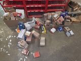 a pile of boxes on the floor of a warehouse