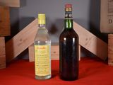 a bottle of wine next to a bottle of wine on a table