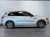 the new volvo suv is parked in a showroom