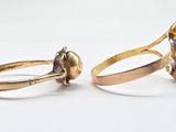 two rings that are sitting next to each other on a table