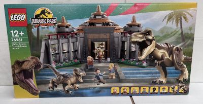 the box is open to show the contents of the lego jurassic set