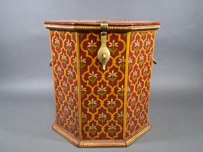 a red and gold box with a gold handle on it
