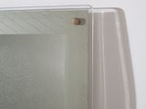 a glass shelf with a mirror on top of it