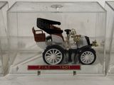 a small model of a car in a clear box